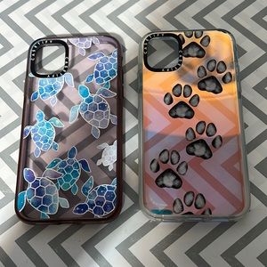 Iphone 11 Casetify cases. One turtle printed one and one  paw print.